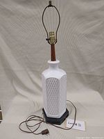 Full view of retro ceramic and wood table lamp showing entire height and design.