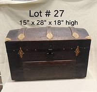 Front view of antique steamer trunk showing dimensions and dome-top structure with straps and metal hardware.