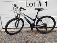 Side view of the mountain bike showing the full frame, tires, and components.