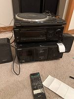 Front view of stacked Technics turntable, Sony control center, Sony CD changer