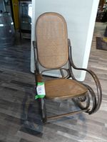 Full view of bentwood rocking chair with cane back and seat, showing curved armrests and scroll rocker design.