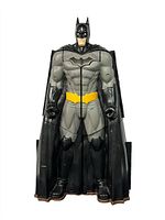 Batman figure shaped in a closed bat silhouette form resembling a bat symbol.