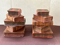 Pair of carved wood bookends shown from front angle.