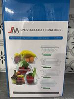 Box front showing 6pc stackable fridge bins product with fruits inside and features.