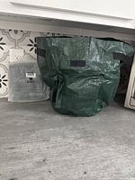 Single green grow bag displayed on a counter, showing size and fabric texture.