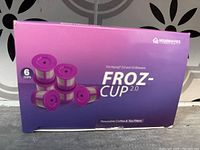 Front view of sealed purple box containing 6 reusable coffee and tea filter pods labeled FROZ-CUP 2.0 by Housewares.