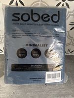 Front of the original packaging showing Sobed brand and material composition details for the navy duvet cover set.