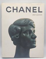 Front cover of the book showing a dark greenish sculpture profile on a white background with the title 'CHANEL' and author 'Jean Leymarie'.