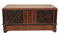 Front view of the closed wooden box showing the Tunbridge ware patterned panels and drawer.
