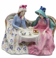 Front view of the Royal Doulton Afternoon Tea figurine showing two women enjoying tea with detailed dresses and table setting.