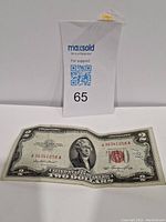 Front side of the 1953 $2 silver certificate bill with visible serial number and red seal.