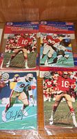 Four collectible autographed static cling stickers in original packaging, showing various football players from the 49ers with signatures.
