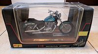 Front view of the Maisto Honda Shadow motorcycle model in original box showing the motorcycle and box design.