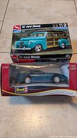 Boxed AMT '41 Ford Woody model kit and Revell 1:24 die-cast Corvette ZR-1 car in packaging