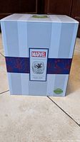Front view of the new sealed box showing Marvel logo and Spider-Man illustration on the label.