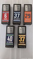 Five Tim Hortons NHL Superstar collectable sticks in sealed packaging, showing player numbers and names Weber, Hellebuyck, Draisaitl, Pettersson, Bergeron