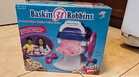 Front of box showing Wham-O Baskin Robbins ice cream maker toy, slight box wear