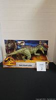 Front view of Jurassic World Yanghuanosaurus dinosaur toy in original box showing the toy fully visible in packaging.