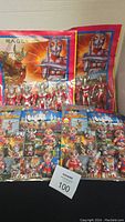 Four KO Ultraman blister card packages are shown with figures visible and colorful artwork in background. Packaging shows considerable wear and damage.