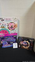 Three boxed kits: Alex DIY Piñata Party, Galaxy Slimeup slime kit, and Laser Pegs vehicle kit