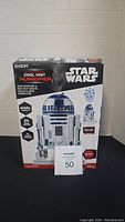 Front view of the box showing the Emson Star Wars R2-D2 Cool Mist Humidifier with product features and branding.