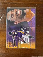 Front side of the 2000-01 Upper Deck Kobe Bryant Y3K Card #187 showing Kobe's smiling portrait and action basketball image in Lakers purple and gold.