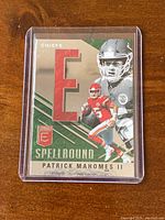 Front of the 2021 Panini Donruss Elite Patrick Mahomes Spellbound Insert Card #S-E showing player images, team, and design features.