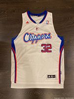 Front view of white Adidas Blake Griffin Los Angeles Clippers NBA jersey, size XL with length +2, showing Clippers logo, number 32, Adidas and NBA logos.