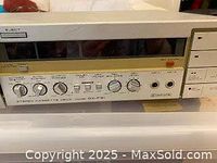 Close-up of Akai GX-F31 stereo cassette deck showing control panel and cassette mechanism.