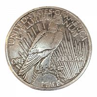 Close-up of reverse side showing bald eagle perched on rock with olive branch, inscriptions around the edge.