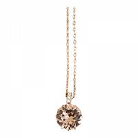 Close-up of the gold-tone chain with round faceted gemstone pendant, showcasing the pendant's sparkle and fine chain details.