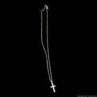 Full view of the sterling silver cross pendant necklace against a black background, showing the length of the chain and the simple cross pendant.