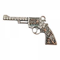 Front view of rhinestone revolver pendant showing detailed rhinestone embellishment and copper-tone floral handle decoration.