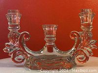 Full view of the Cambridge Caprice glass candlestick showing both candle holders and detailed scroll and leaf design.