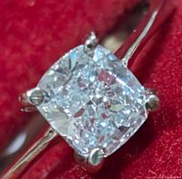 Close-up top view of cushion cut diamond showing facets and sparkle