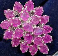 Front view of ring head showing cluster of pear-shaped rubies