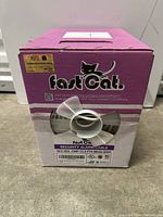 Front view of pink box with fast cat security alarm cable label showing product details and logo with a cat.