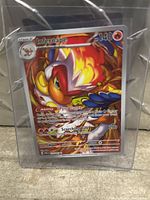 Holographic Infernape Pokémon trading card sealed in a clear protective sleeve showing front of card with artwork, stats, and details.