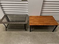 Two tables side by side, patio table with glass top and a wooden coffee table.