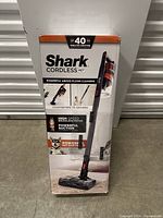 Photo of the Shark Cordless Pet vacuum cleaner box showing product features and branding.