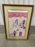 Full view of the framed watercolor artwork depicting a stage scene with performers and audience, matted and framed in gold-tone frame.