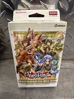Sealed Yu Gi Oh Structure Deck box shows colorful characters and dragons on front with Konami and English Edition markings.