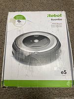 Top view of the original iRobot Roomba e5 box showing branding and product image.