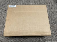 Closed cardboard box labeled Linksys as original packaging