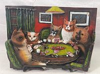 Front view of ceramic wall plaque depicting five cats around a poker table with cards and chips, room background with red walls and green curtains.