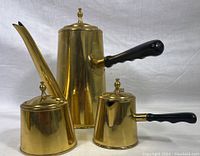 Full set front view showing coffee pot, creamer, and sugar bowl against neutral background.