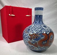 Front view of vase with original red fabric cushion box