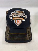 Front view of the baseball cap showing the embroidered '2010 World Series Champions Fall Classic' logo and SF Giants emblem.
