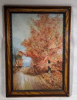 Framed original oil painting showing autumn tree and path.