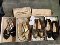 Four pairs displayed in original boxes with two Manolo Blahnik dust bags